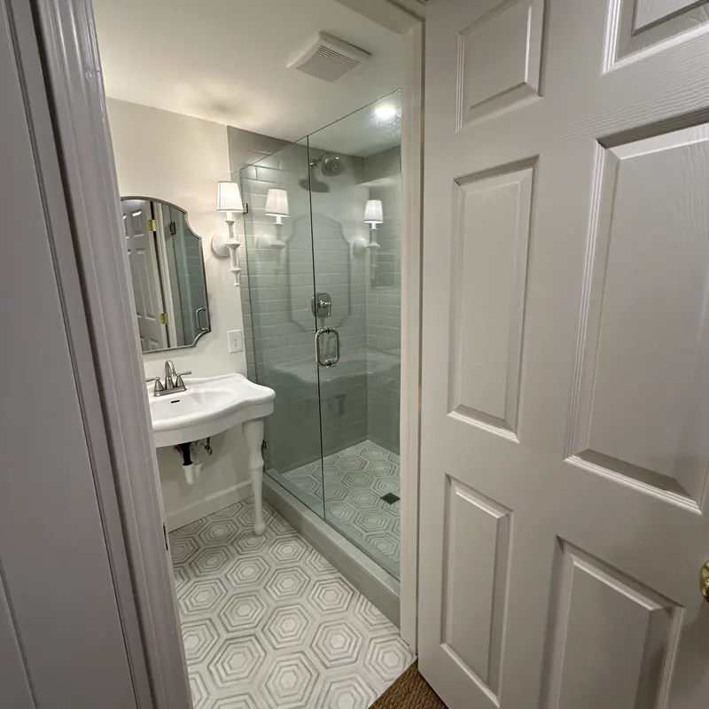 Classic shower and hex tile floor with pedestal sink, Atlanta GA