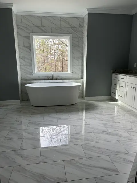 Polished marble-look tile floor with freestanding tub, Atlanta GA