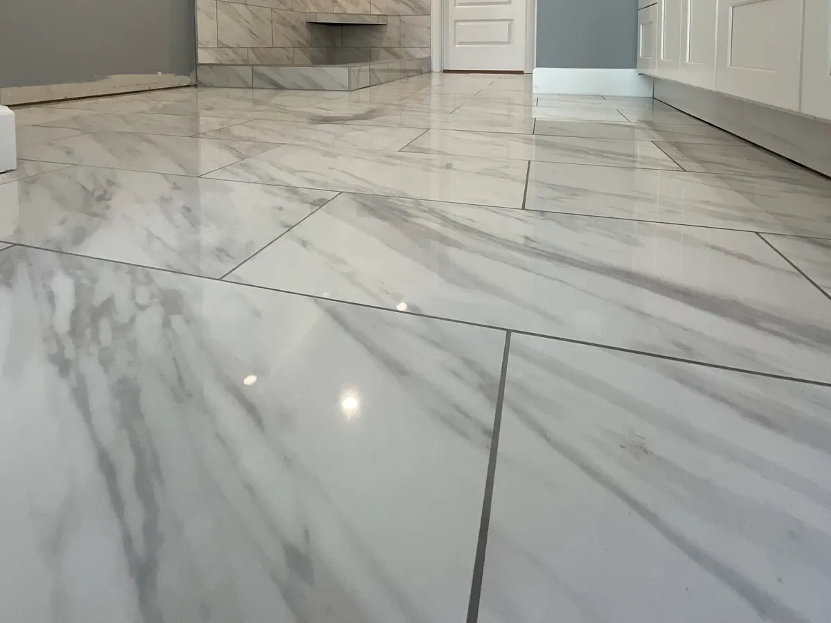 Polished marble-look porcelain floor installed in an Atlanta home